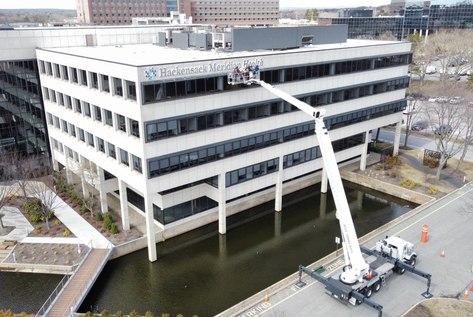 Signage Installation in Hard-to-Reach Spaces with Alpha Platforms Boom lift 250ft