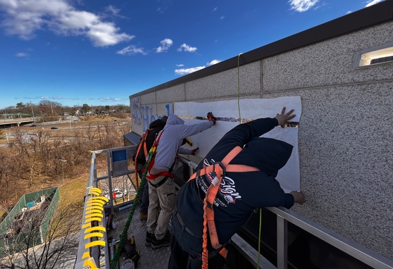 Crew in the Man Basket during the Signage Installation in Hard-to-Reach Spaces