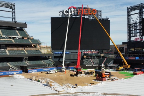 How to Squeeze 250-Ft Boom Lift into a Ballpark to Hang a Sign Above the Tallest Scoreboard