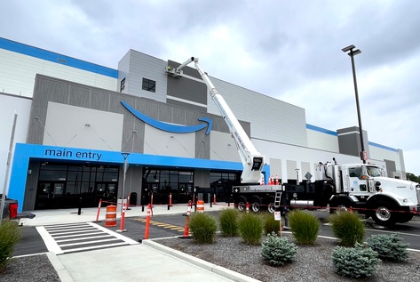 AlphaPlatforms 250' lift at Amazon Warehouse entry