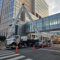 Philadelphia CHOP Sign Replacement With Crane Collaboration 300 ft Boom Lift